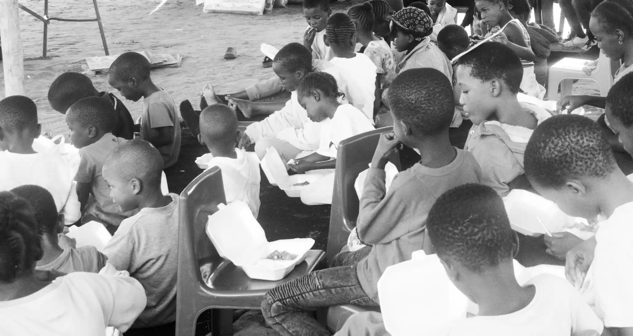 Children eating nutritious meals during Lehikeng Trust's community feeding programme in Maun, Botswana, supporting vulnerable children with food, care, and opportunities to thrive.